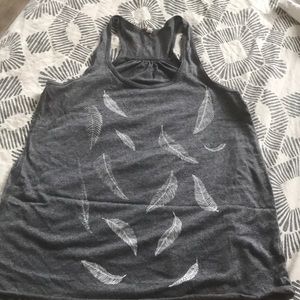 Red prairie press tank with feathers.